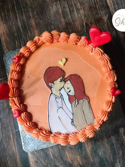 Edible sketching is such a fun way to bring out the creative side. This bento cake features a sweet, hand-drawn illustration of a couple.