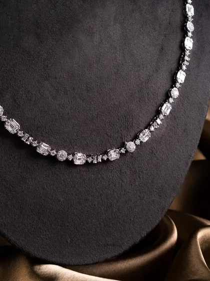 The Celeste Radiance necklace, a clean line of mixed diamond cuts that sits beautifully on the collarbone.
