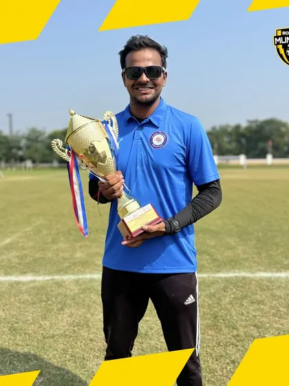 Our Head Coach, Suraj Sir, holding the WIFA Inter-District trophy. His leadership as Team Manager for the Mumbai U15 team is a source of immense pride.