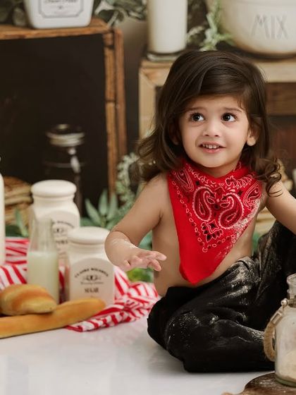 A little baker getting delightfully messy with flour. Our chef and baker themes are perfect for capturing playful and action-filled photos.