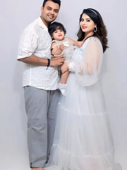 Capturing a precious family moment. This white sequin and tulle gown is perfect for maternity shoots, and we even have matching options for little ones.