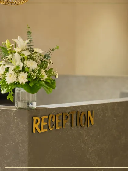 The reception desk at our Ahmedabad store, a place of warm welcomes. I wanted the first impression to be one of simple, understated elegance.