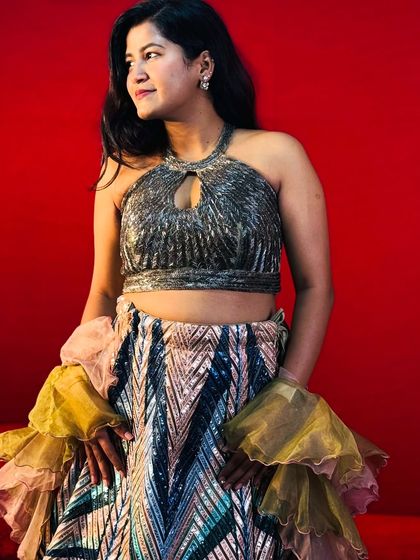 A studio shot of the trendy geometric lehenga, showing off the sparkling details of the halter-neck blouse.