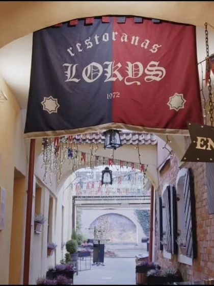 A still from the short film "Restaurant Lokys Historic Tour," screened during our Europe Day celebration. This image of a historic European alleyway gives a glimpse into the cultural cinema we showcase.