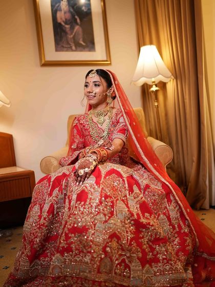 This bride looks like she stepped out of a dream. Her intricate red lehenga is perfectly balanced with a soft, glowing makeup look.