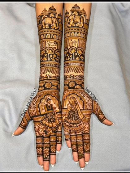 This design features a dancing bride and groom, capturing the joy of the wedding. The arms are decorated with elephant motifs and jharokha patterns, adding a royal touch.