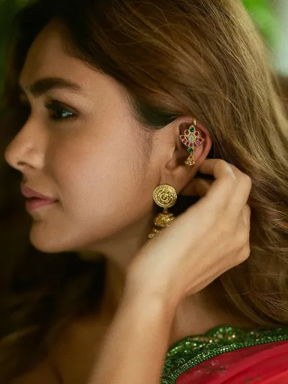 Another beautiful shot of Mrunal Thakur wearing the Alayaa earcuff and jhumkas, demonstrating how to style traditional pieces with modern grace.