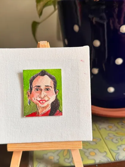 My mini portrait of Shubhi on an easel.
