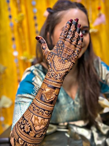 A full-arm design for a Krishna devotee, featuring different elements of Krishna's life and symbols. The client's faith is beautifully woven into the art.