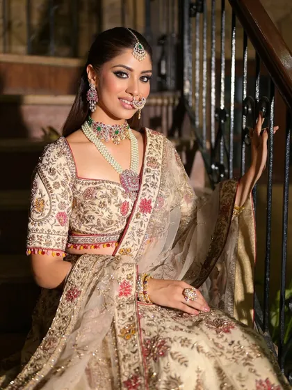 A relaxed and happy portrait on the stairs. The bride's smile shows her confidence in this beautiful, regal look.