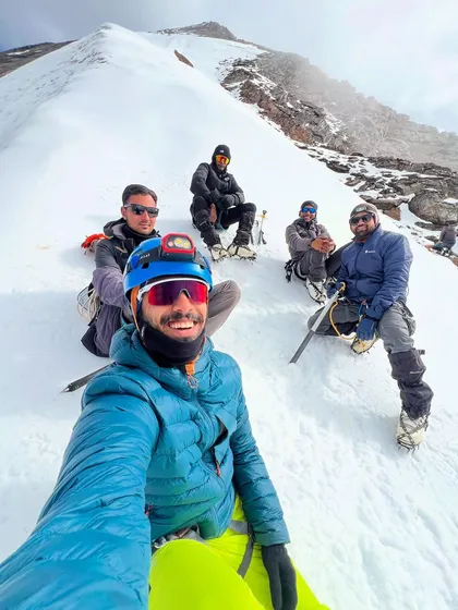 A selfie break on the snowy slopes of Friendship Peak. Even on a tough climb, there's always time for a smile.