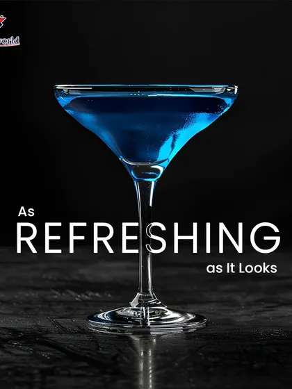 A minimalist yet striking blue cocktail served in a classic martini glass. Its clean lines and vibrant color prove that sometimes, simplicity is the ultimate refreshment.