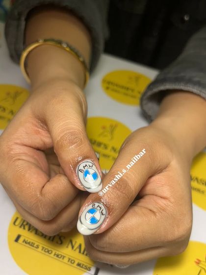 For the car enthusiast, this set was inspired by BMW. I hand-painted the logo, the iconic M-series stripes, and a checkered racing flag for a high-speed manicure.