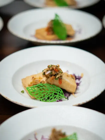 Another exquisite dish from our global tasting menu. This close-up highlights the careful preparation and artistic plating that goes into every course, ensuring the food is as beautiful as it is flavorful.