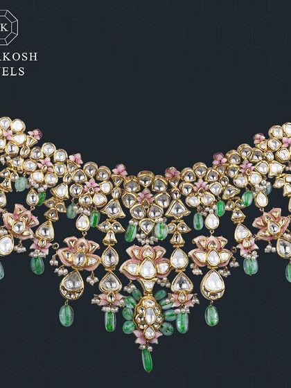 Every bride deserves to feel like royalty. Our Jadau necklace with polki, emeralds, and pink enamel captures the essence of tradition and elegance for the perfect bridal look.