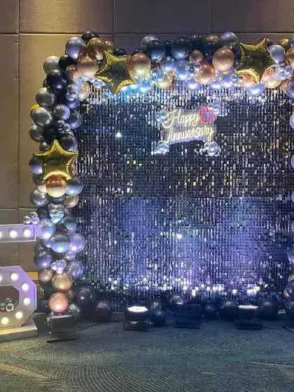 Another view of the 25th-anniversary photo booth, showing the full setup with spotlights. I ensure every corner of your event is picture-perfect.