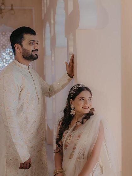 Another beautiful shot from the pre-wedding shoot. The couple's coordinated outfits and the bride's elegant makeup create a timeless and romantic image.