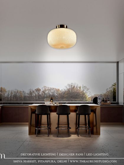 This white textured glass pendant offers a softer, more subtle approach. It proves that a single, well-chosen light fixture can be a piece of art that illuminates the entire room.
