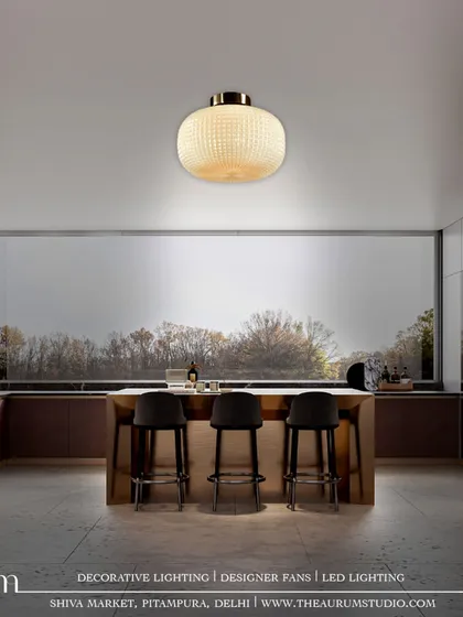 This white textured glass pendant offers a softer, more subtle approach. It proves that a single, well-chosen light fixture can be a piece of art that illuminates the entire room.