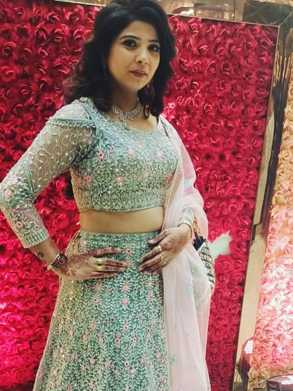 Another shot of the mint green and pink floral rental lehenga. The full-sleeved blouse makes it a great choice for cooler weather.