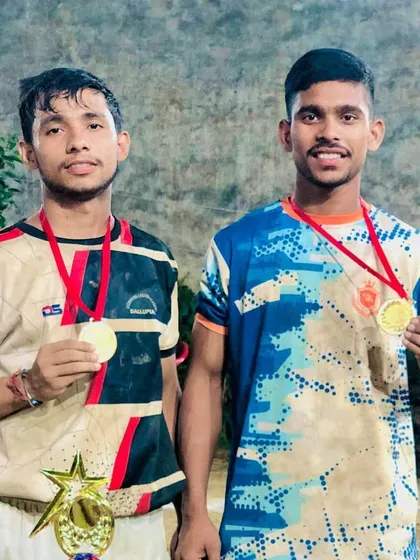 Teammates showing their medals after a victorious tournament.