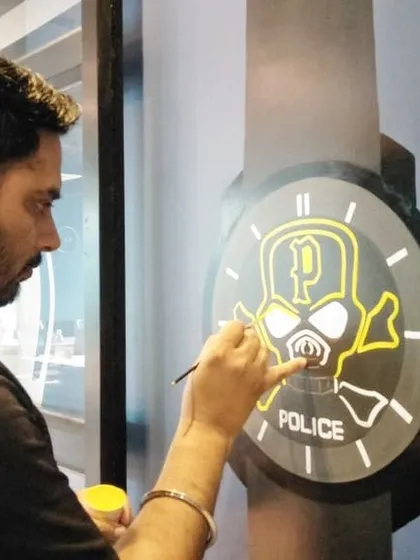 Working on another custom watch mural, this one for the "Police" brand. The design features a skull and crossbones, giving it an edgy, modern look that matches the brand's identity. This is a great example of how I can adapt my style to fit any brand.