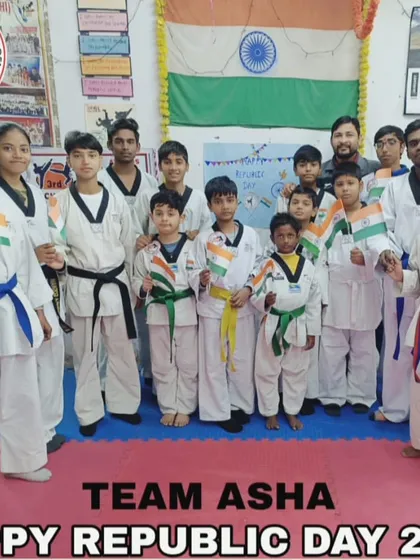 Team ASHA celebrating Republic Day at the academy, holding the Indian flag with pride.