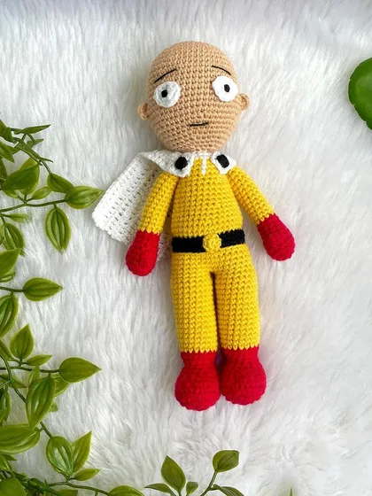 Saitama from One Punch Man! This doll captures his simple yet iconic yellow suit, red gloves, and classic unimpressed expression. It was fun to see the joy this brought to a fan.