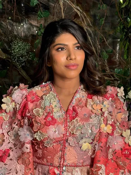 A gorgeous look for a birthday celebration. The client's stunning floral dress inspired this soft and pretty makeup look, featuring shimmering pink tones and effortless waves.