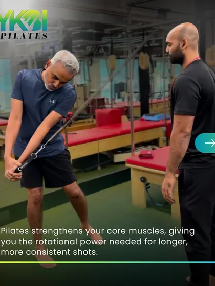 Pilates strengthens your core muscles, giving you the rotational power needed for longer, more consistent shots in golf. This client is simulating a swing using the Cadillac tower.