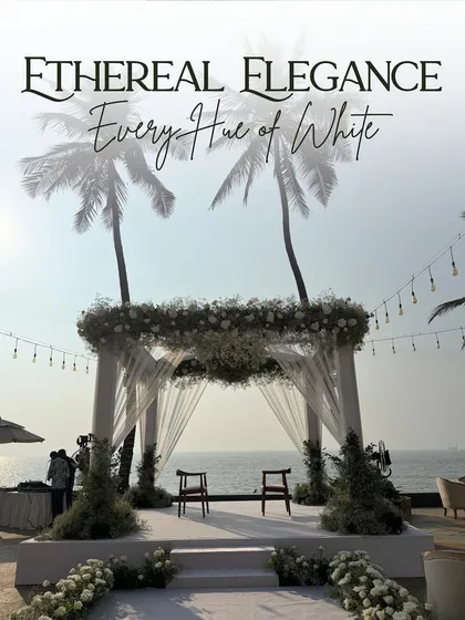 I design ceremonies that harmonize with their surroundings. This ethereal beachside mandap, crafted with delicate white florals and sheer drapes, stands as a testament to minimalist elegance, allowing the beauty of the ocean and the sky to become part of the sacred space.
