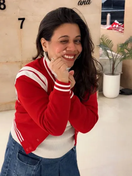 A playful wink for the camera. The holiday season is full of fun, candid moments like this one.