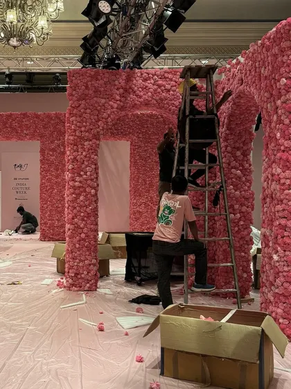 Another view of the meticulous setup process. My team works tirelessly, often for days, to ensure every single stem is perfectly placed to create a flawless floral texture.