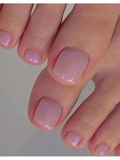 For a subtle and clean look, we offer simple gel pedicures. This sheer pink polish gives the toenails a healthy, glossy, and perfectly manicured appearance.