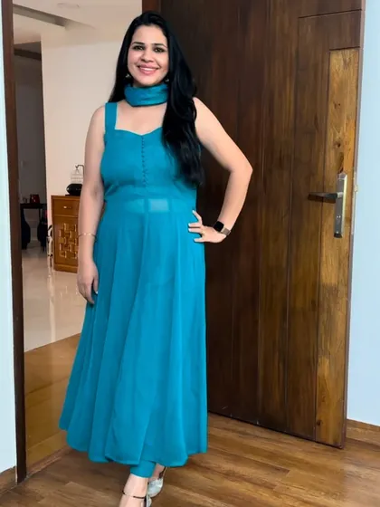 A plain blue georgette saree was used to create this "Dil Toh Pagal Hai" inspired Anarkali. It's simple, elegant, and the sheer waist panel adds a modern touch.