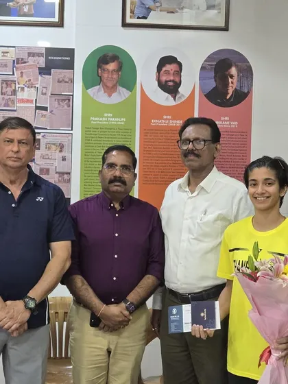 Chief Coach Shrikant Vad with Malvika Bansod during her felicitation by local dignitaries, a proud moment for the academy.