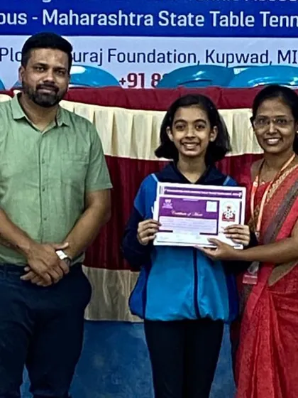 Hrithika Madhur receives her certificate for winning a bronze medal in the U-15 girls' event at the 5th Maharashtra State Ranking tournament.