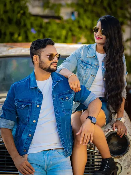 A cool, casual portrait with a couple in matching denim jackets posing with a vintage car. This shows our versatility in creating styled, thematic pre-wedding shoots.