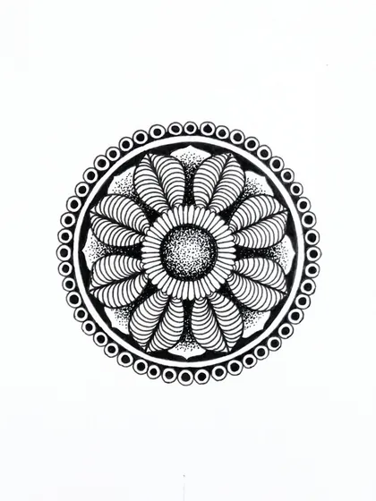 This circular mandala features leaf-like patterns and a stippled center. It's a calming, nature-inspired design created with fine-liner pens.