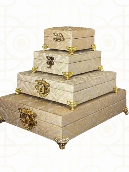 This stacking set of four brocade boxes is both beautiful and functional. The varying sizes are perfect for organizing everything from large garments to small, precious items.