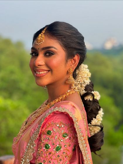 Falling for her smile. A beautiful portrait of a dusky bride in a pink Kanjeevaram saree.