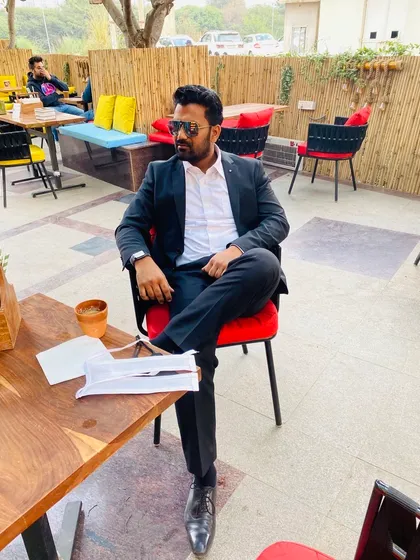 Seated at an outdoor cafe, a moment of thought before a meeting. I firmly believe that law is the bedrock upon which society stands.