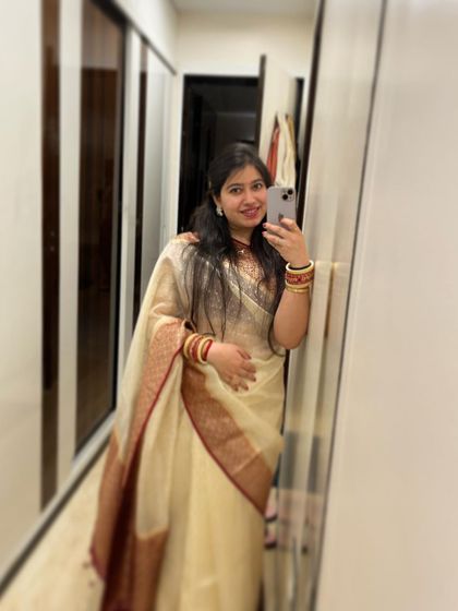 A mirror selfie showing off a traditional saree. My personal style is a blend of classic and comfortable, much like my approach to dance.