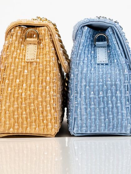 A detailed side-by-side shot of my crystal bags. This view highlights the quality of the hand-strung beadwork and the sturdy construction of these beautiful, structured handbags.