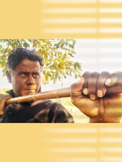 A close-up, intense shot with the Bo Staff, emphasizing the grip and readiness for action.