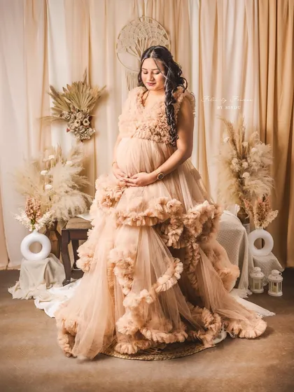 Another beautiful seated portrait in the Paige gown. The boho-themed backdrop adds a warm and rustic feel.
