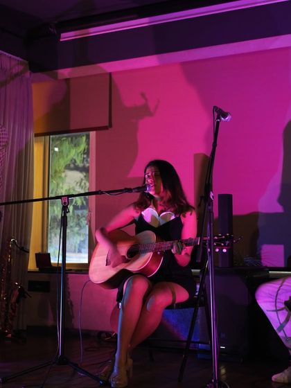 A full view of my solo setup at Darry's House. Just me, my guitar, and a room full of music lovers.