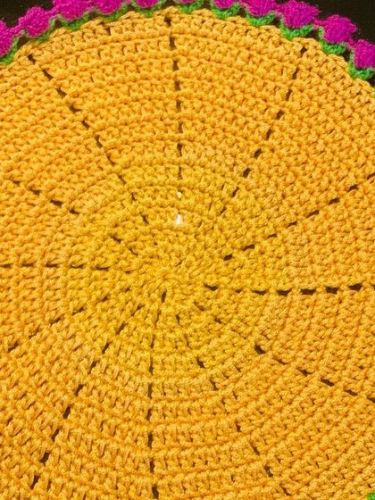 A bright yellow doily with a contrasting pink tulip border. This combination is perfect for someone who loves bold and cheerful colors.