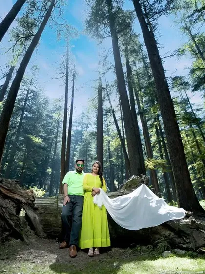 Using a wide-angle lens to capture the scale of the deodar forest in Himachal. This pre-wedding photo makes the couple the heart of a majestic landscape, showing how I use nature to tell a grander love story.