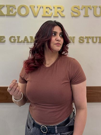 A closer look at this gorgeous red makeover. The color is rich and vibrant, perfectly complementing her skin tone and personal style.